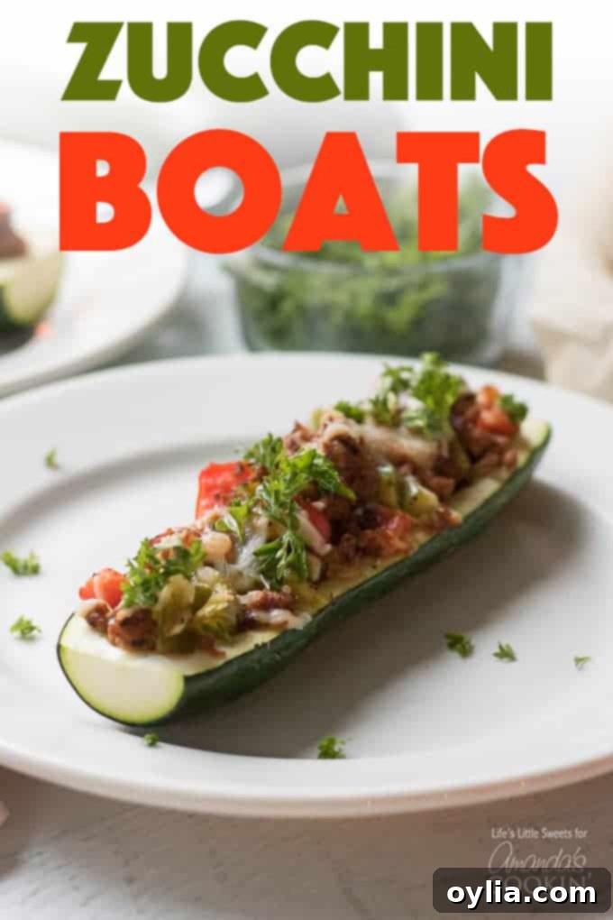 These colorful stuffed zucchini boats are a savory and delicious dinner packed with lean protein and a healthy serving of vegetables. Stuffing zucchini with lean ground turkey, fresh peppers, onions, and grated cheese makes for a tasty low-carb dinner and is a great way to use up all that garden zucchini! #zucchiniboats #stuffedzucchini #zucchinirecipes #lowcarbdinners #lowcarbrecipes #groundturkey #zucchini #amandascookin stuffed zucchini