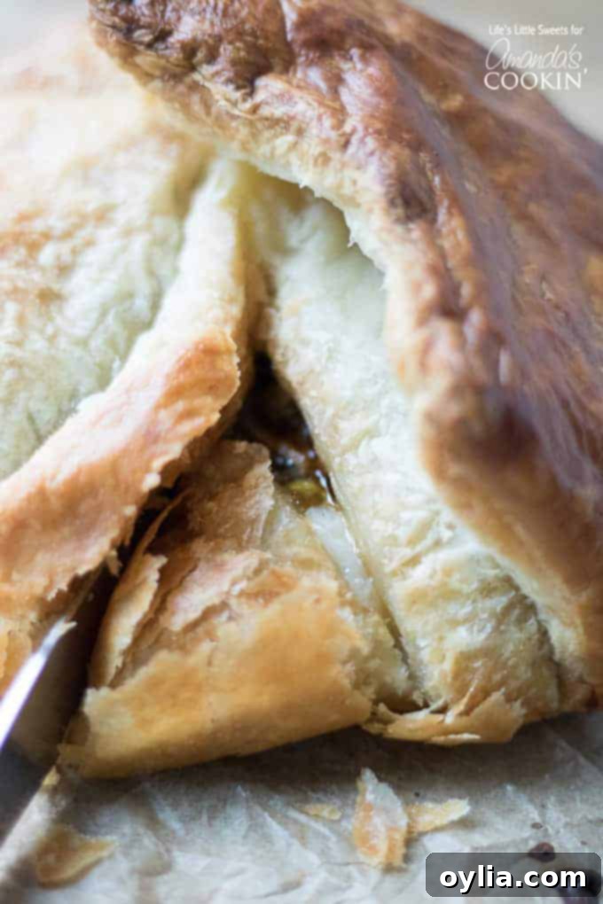 Cutting into the Baked Brie