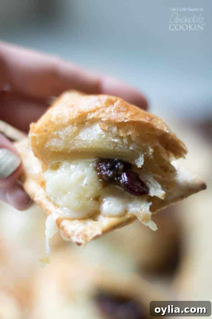A bit of baked brie on crackers