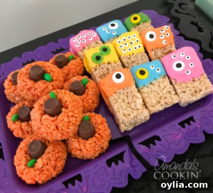 A festive platter of Rice Krispie Treat pumpkins and colorful Rice Krispie Treat monsters, adorned with candy eyes, perfect for a Halloween dessert table.