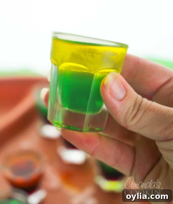 Green and yellow layered jello shots, representing a football team
