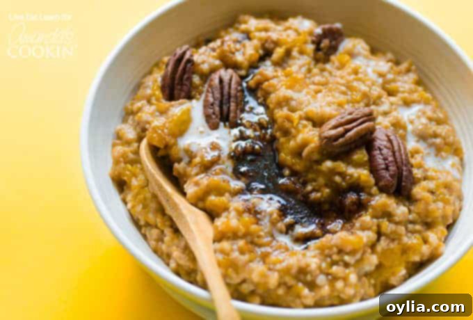 Butternut Squash Oatmeal in a rustic bowl, garnished with pecans and a spoon