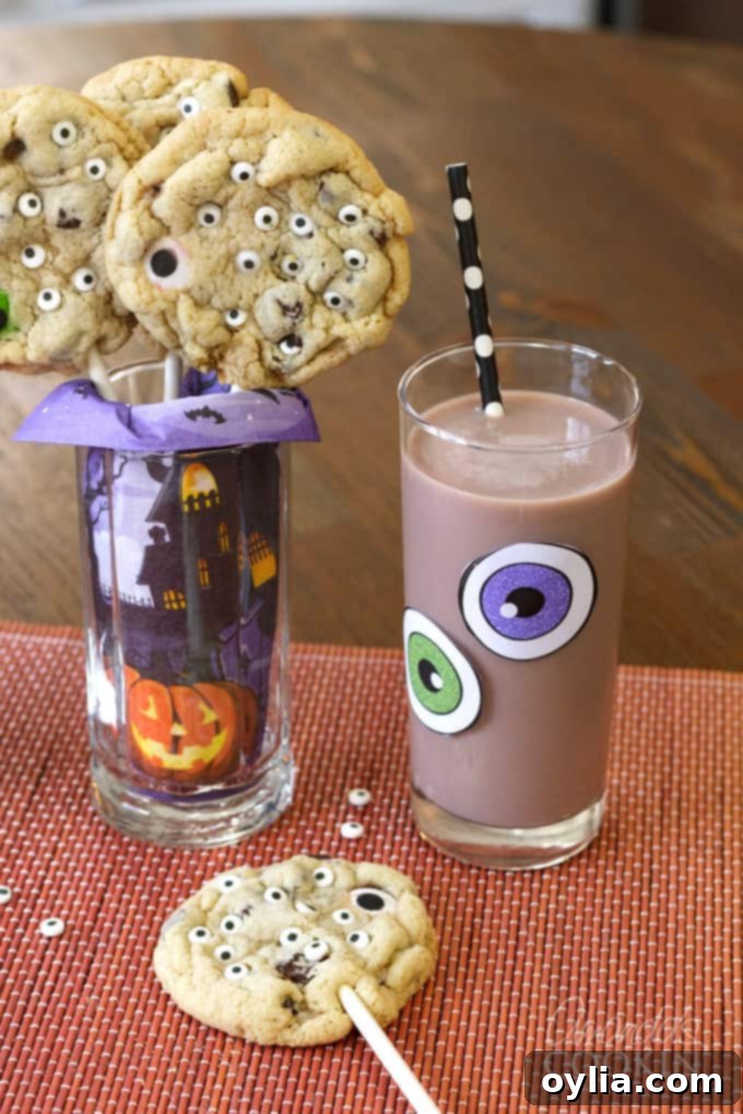 Delicious Monster Cookie Pops with glasses of chocolate milk