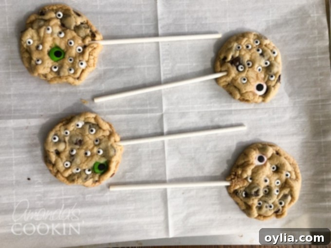 Monster Eyeball Cookie Pops cooling on a wire rack