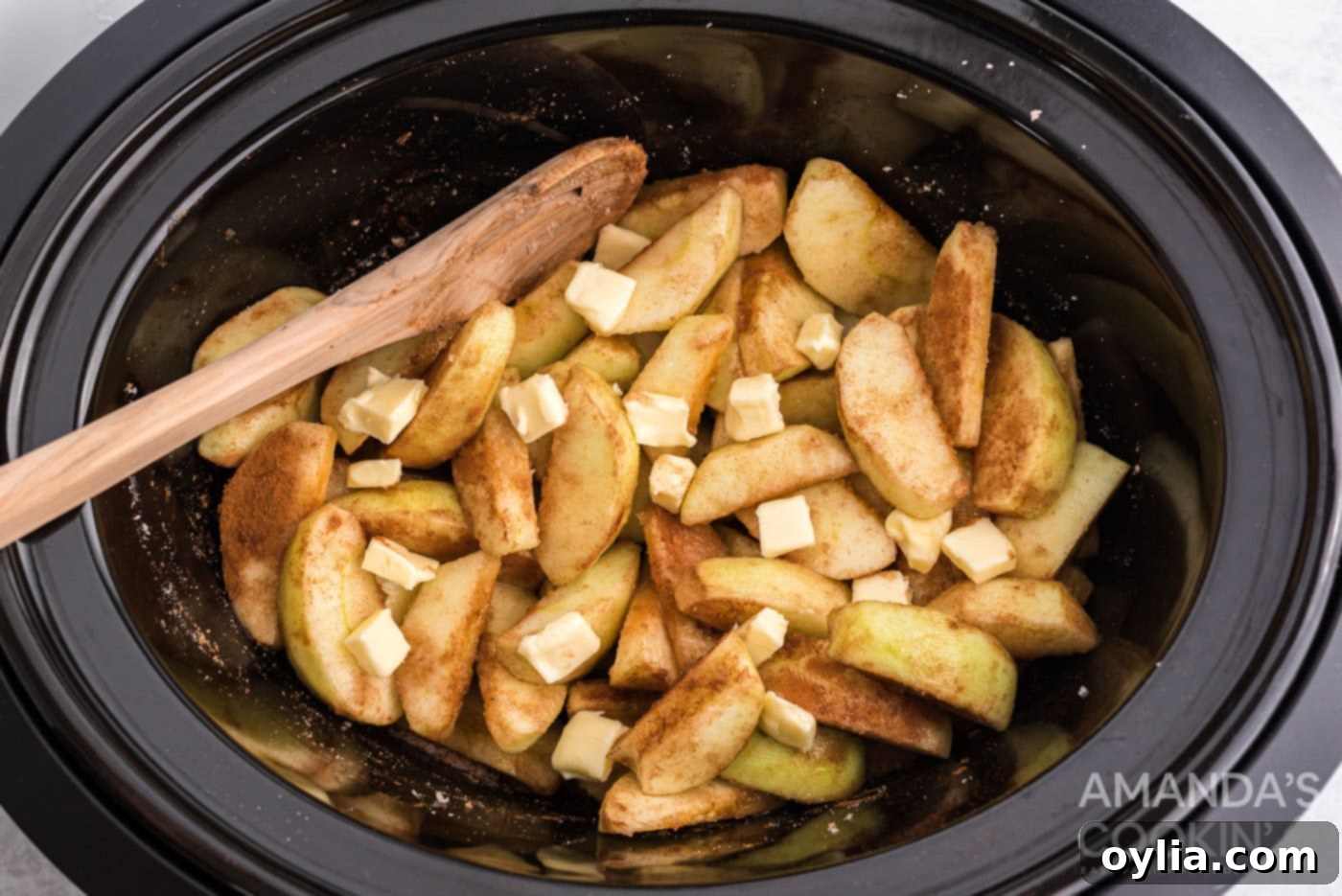 butter on top of cinnamon sugar apples