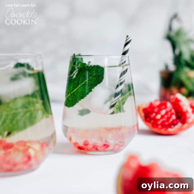 Holiday Detox Drink in wine glasses with straws