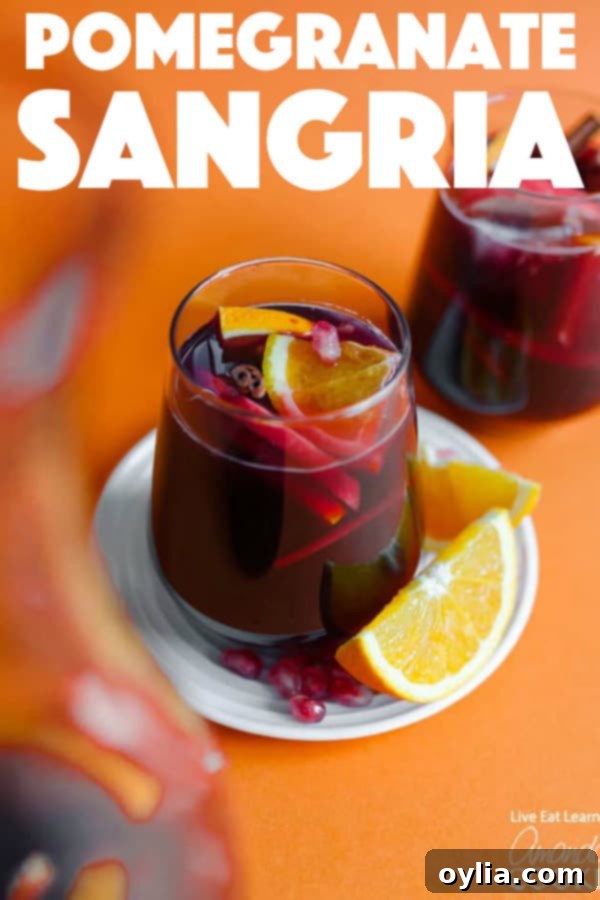 Pomegranate Sangria Pin for Pinterest: Easy recipe for a festive holiday cocktail.
