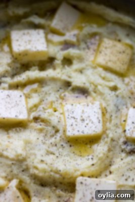 Creamy Traditional Mashed Potatoes topped with butter