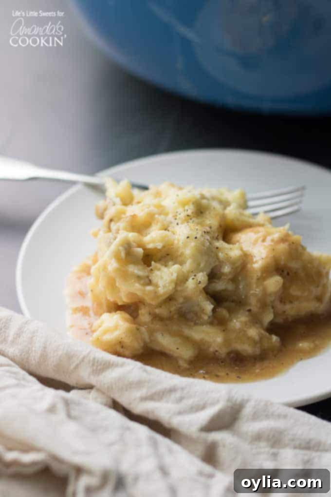 Creamy Traditional Mashed Potatoes Plate of creamy traditional mashed potatoes, garnished with herbs