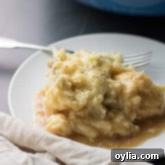 Comforting Potato Cloud 7 Creamy Traditional Mashed Potatoes in a serving bowl with a spoon
