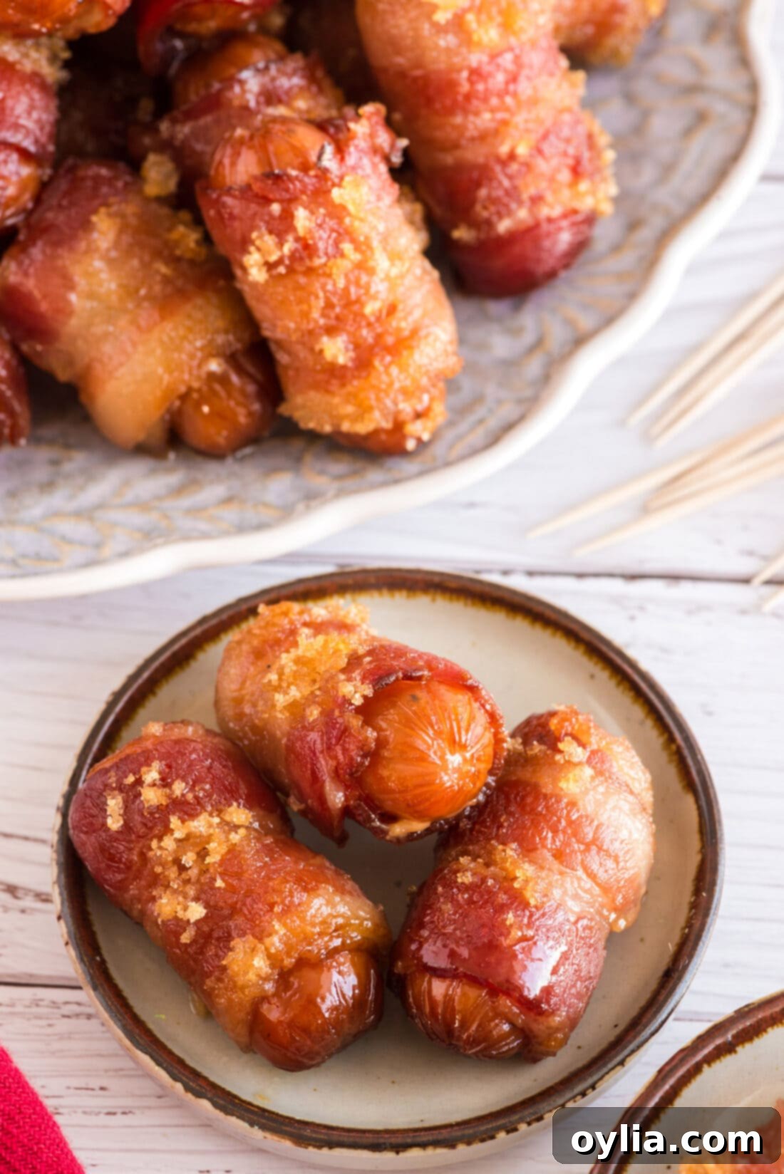 Bacon Wrapped Little Smokies on a plate, perfectly glazed and ready to serve