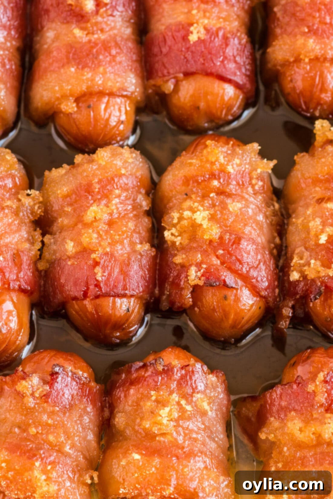 Close up photo of Bacon Wrapped Little Smokies showing the crispy bacon and caramelized sugar