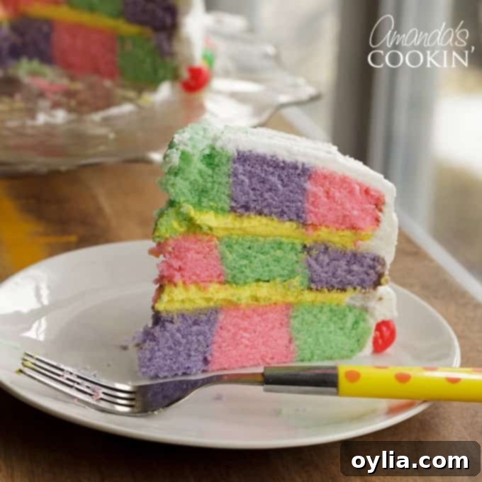 slice of checkerboard cake with a fork