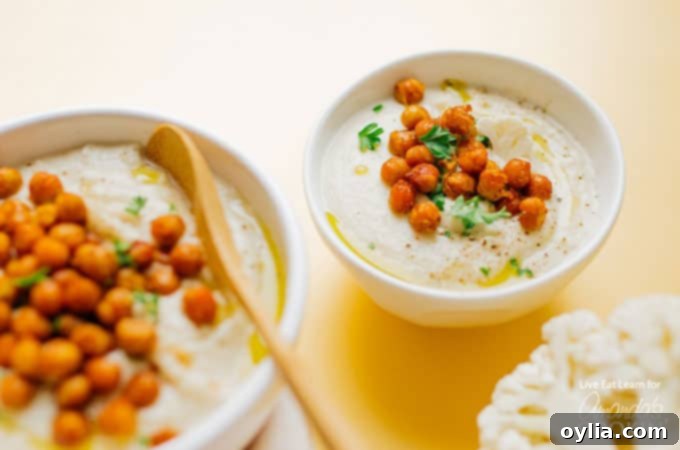 Cauliflower soup in a bowl with a hint of garnish