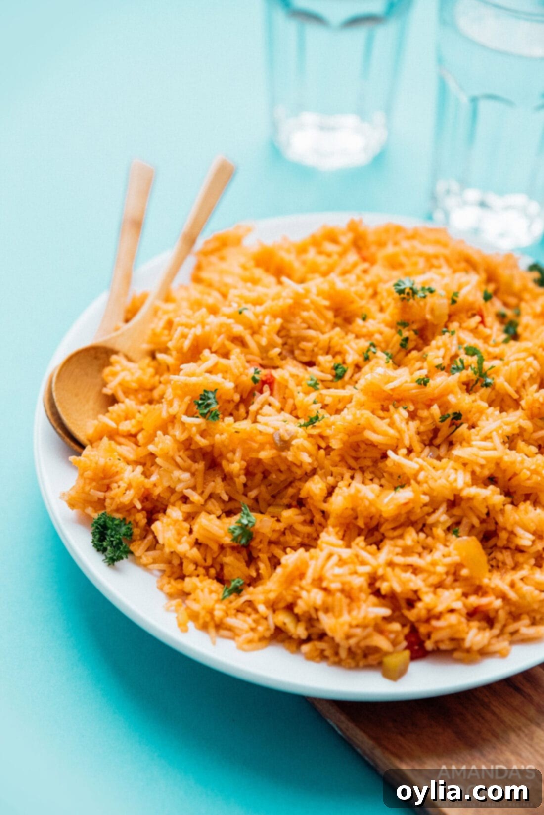 A vibrant plate of classic Spanish rice, garnished and ready to serve.