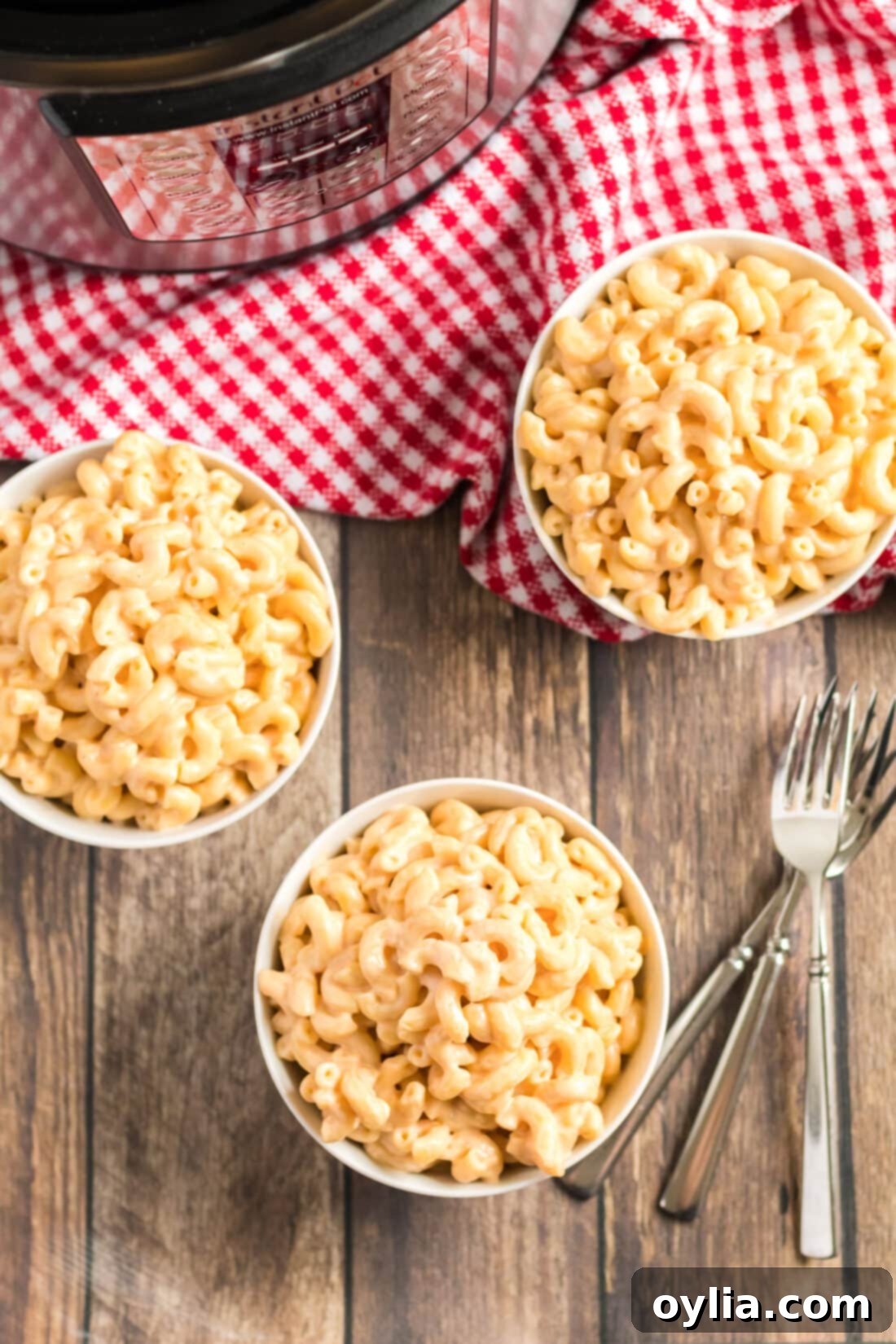 Three bowls of creamy Instant Pot Mac and Cheese ready to serve