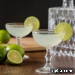 two gimlet cocktails in coupe glasses
