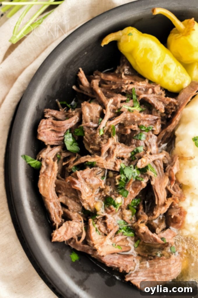 close up of stringy roast in bowl