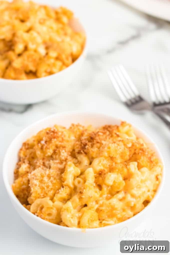 A large bowl of freshly baked macaroni and cheese casserole, golden brown and bubbly