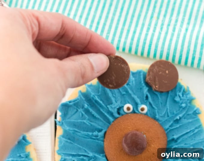 adding candy melts to top of cookie