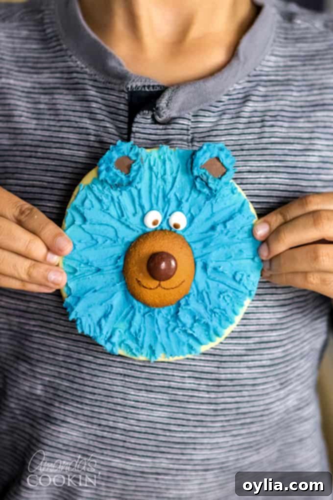 boy holding cookie