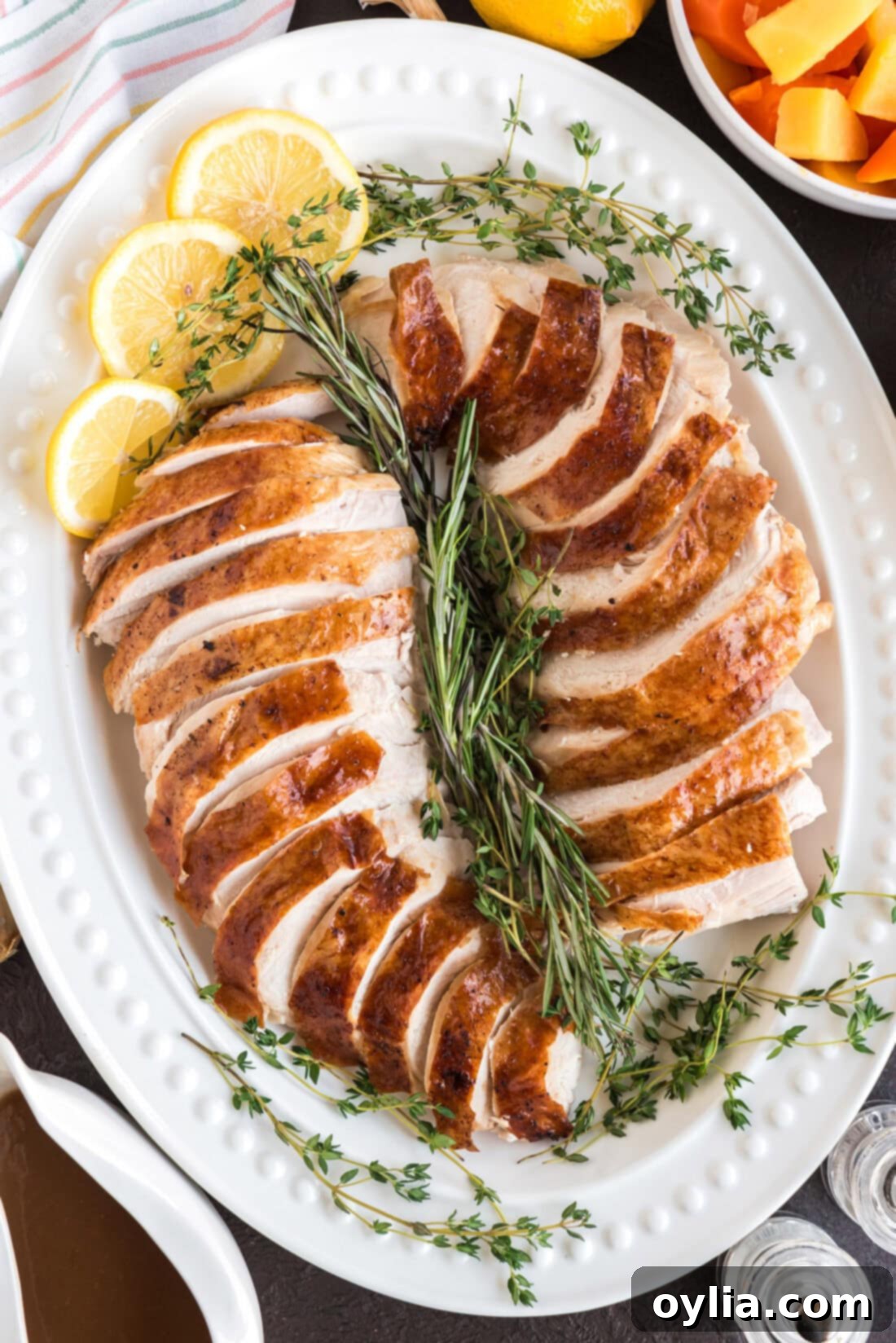 Sliced Roasted Turkey on a white serving platter