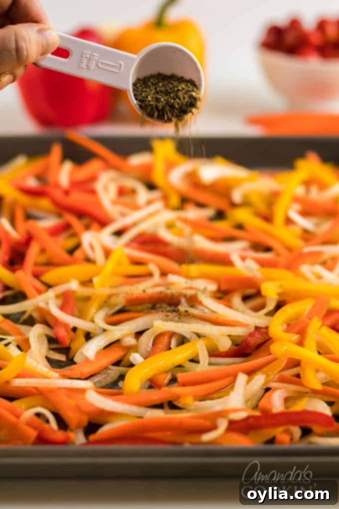 sprinkling dried herbs onto fresh vegetables on a baking sheet
