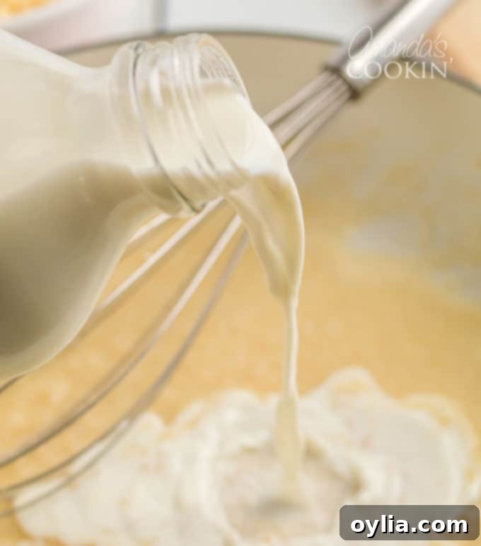 milk bottle pouring into skillet
