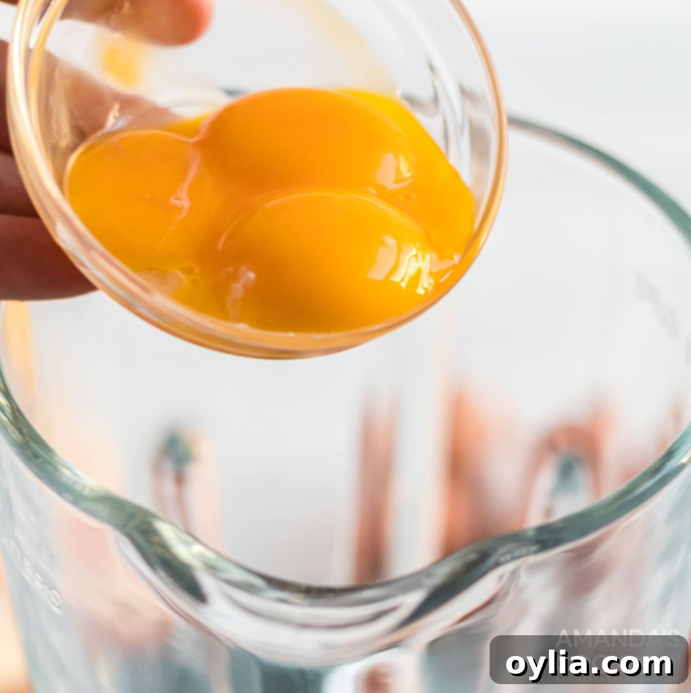 adding egg to blender