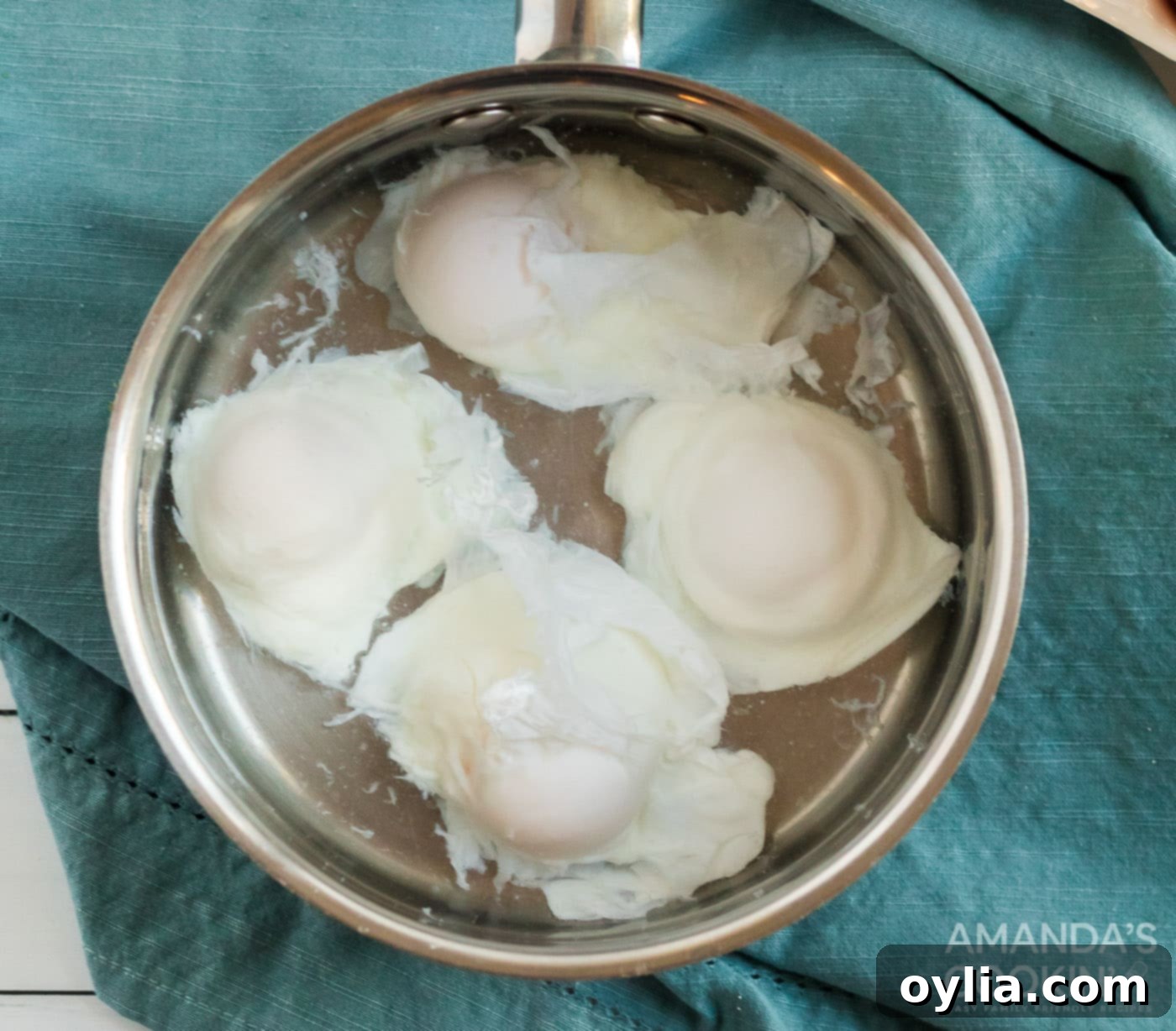 poached eggs in pan