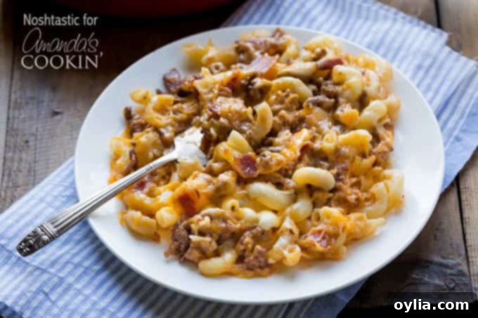 A plate of homemade bacon cheeseburger pasta, a cheesy and meaty meal