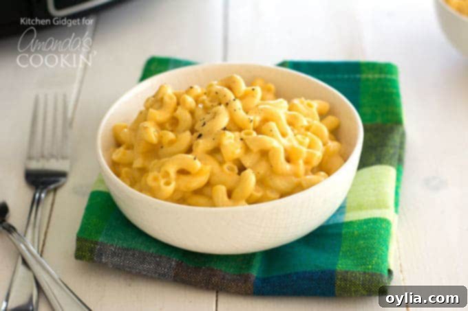 Creamy homemade mac and cheese served in a bowl, cooked in a Crockpot