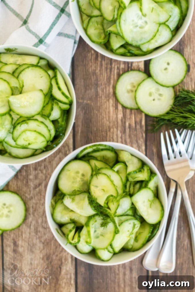 cucumber salad in serving bowls with forks