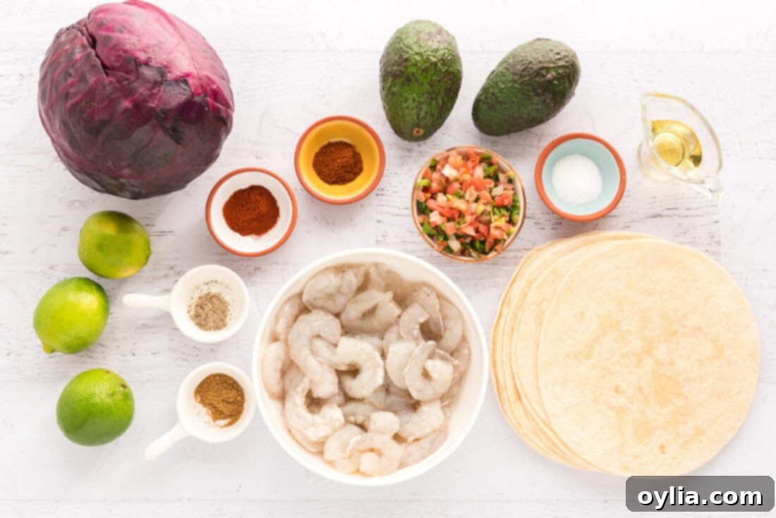 A selection of fresh ingredients laid out, including raw shrimp, various spices, and fresh produce for shrimp tacos