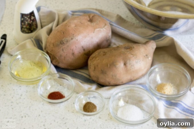 Various spices and sweet potatoes, laid out as ingredients for the recipe.