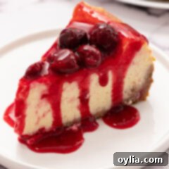 slice of cherry cheesecake on a plate with perfect topping
