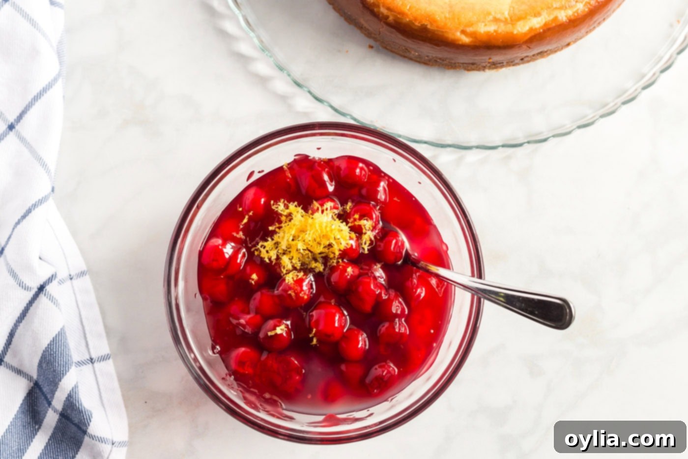 cherry pie filling and lemon rind in bowl for topping