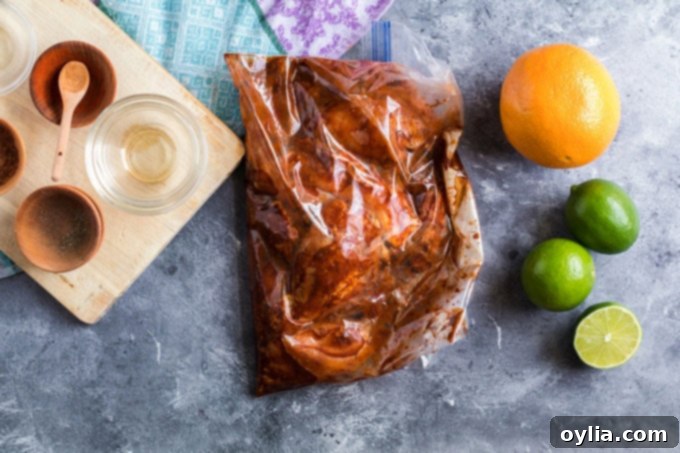 chicken marinating in a plastic bag