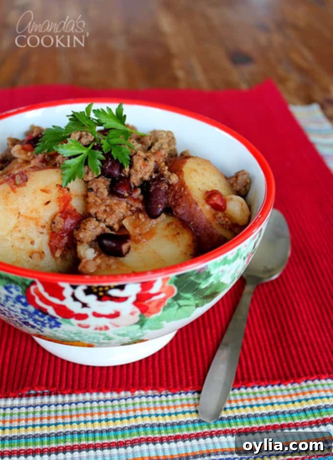 Close-up of hearty Crockpot Cowboy Casserole, showcasing its rich ingredients and comforting appeal.