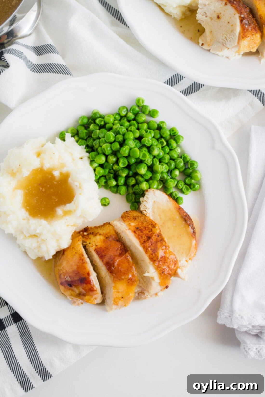 This crockpot chicken recipe is our family's favorite. We make good use of our slow cooker with this spice rubbed sticky chicken at least once a month. Overhead photo of a plate of Crockpot Sticky Chicken