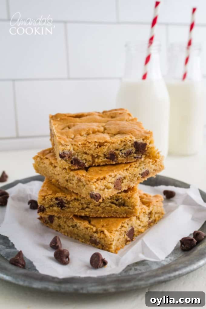 Chewy Chocolate Chip Blondies 2 Delicious Chocolate Chip Blondies with peanut butter chips, perfectly baked and ready to eat.
