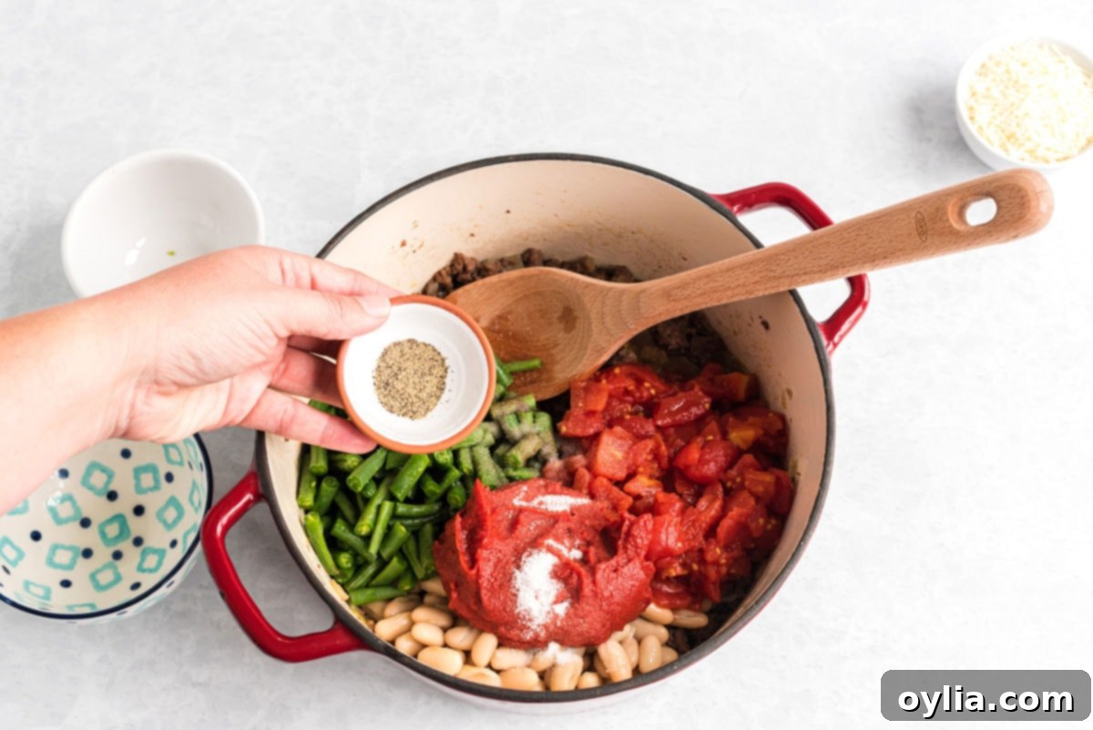 adding seasoning to pot