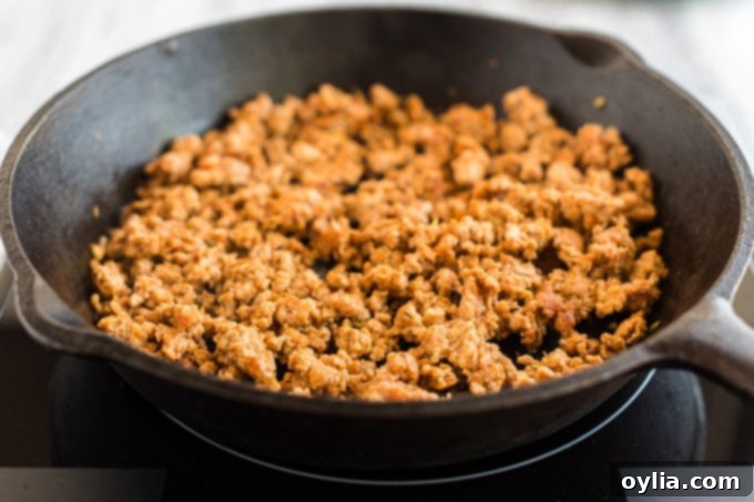 browned ground pizza sausage in a skillet