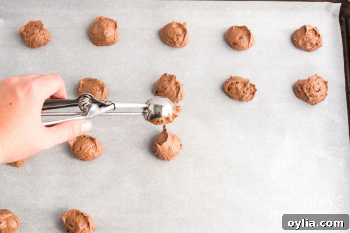 scooping dough onto cookie sheet