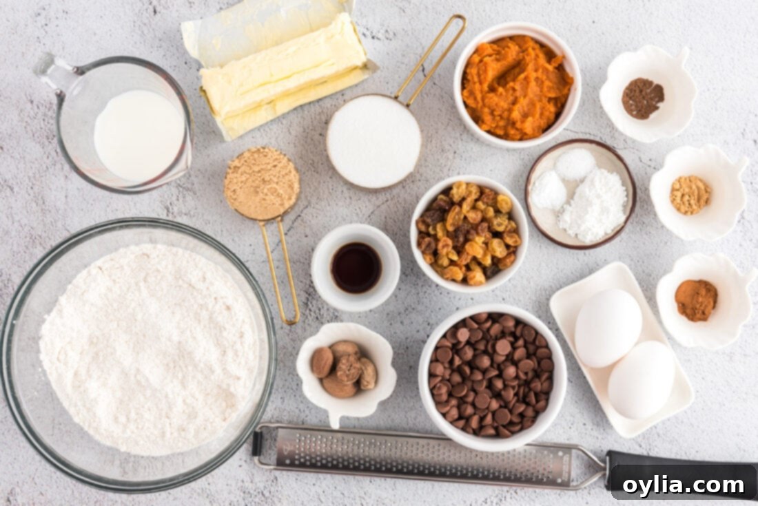 Array of ingredients laid out for making Chocolate Chip Pumpkin Muffins
