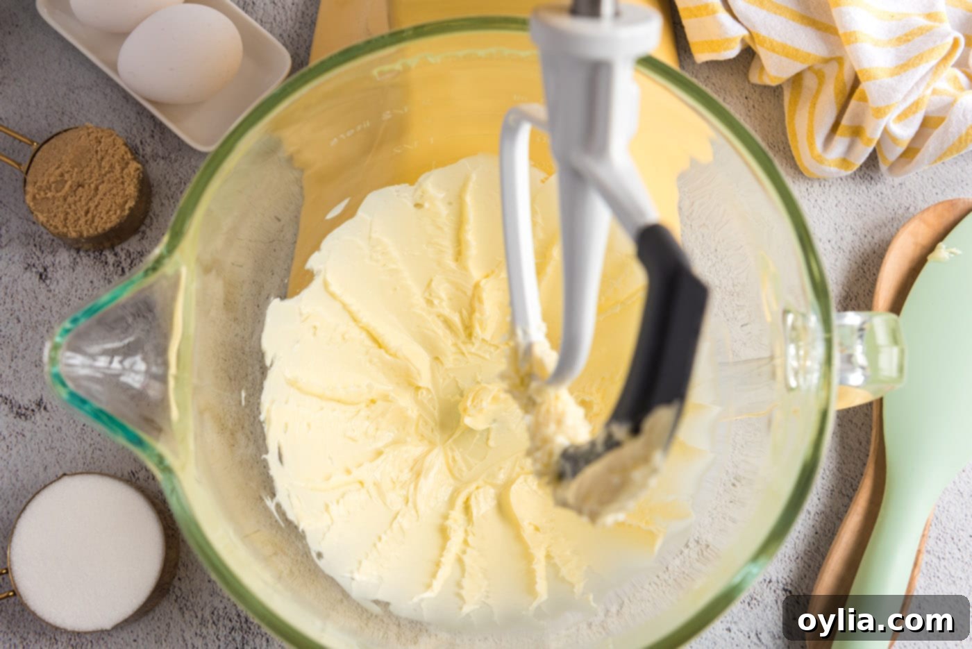 Beating softened butter with a paddle attachment in a stand mixer
