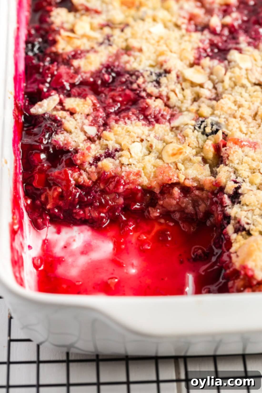 Baking dish of Prize Winning Rhubarb Crumble with a serving removed