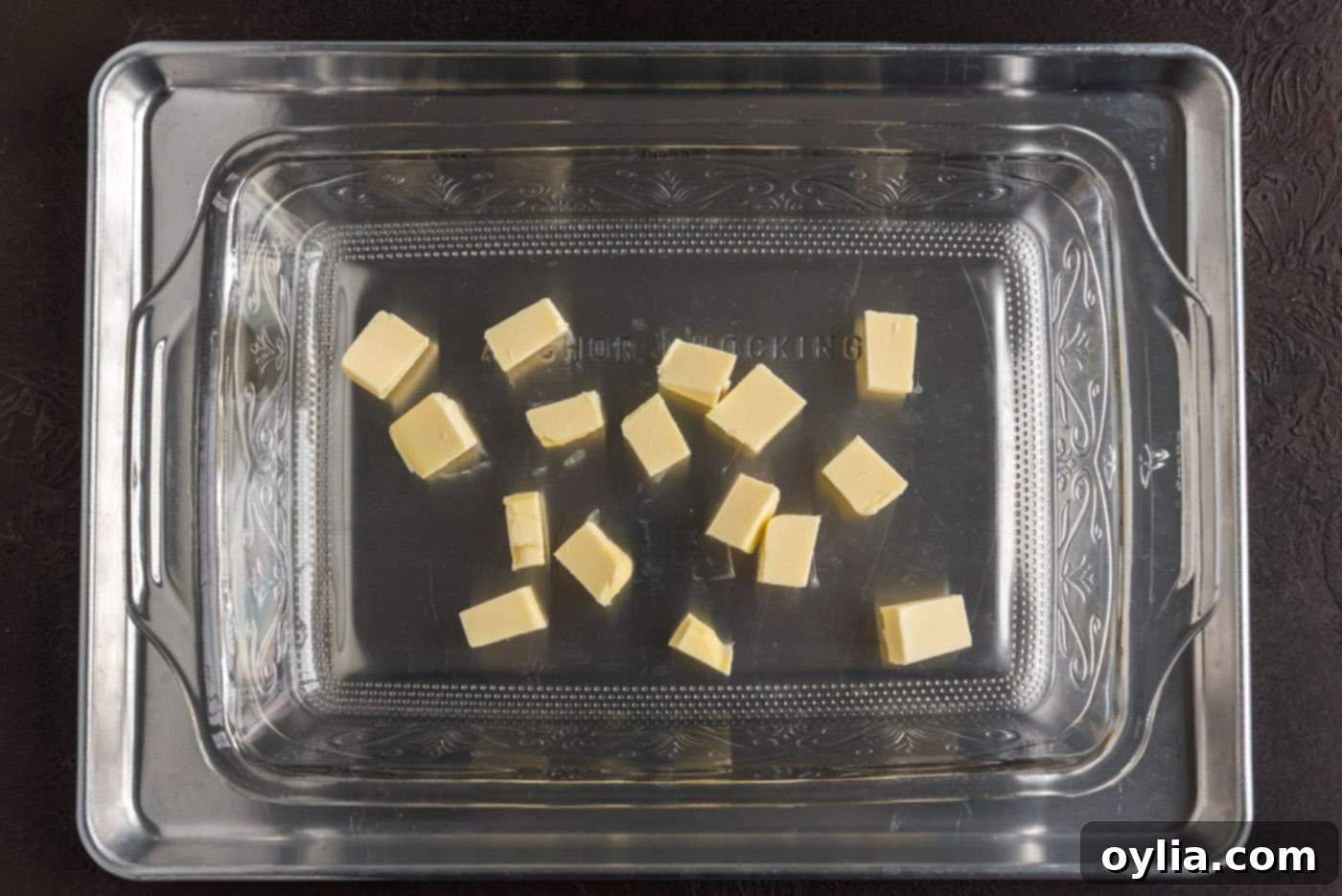 butter pats in a baking dish