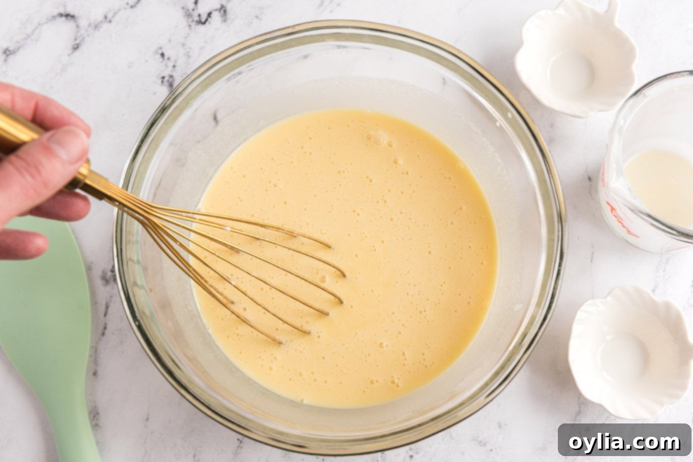 Whisked ice cream custard base in a bowl, showing smooth texture