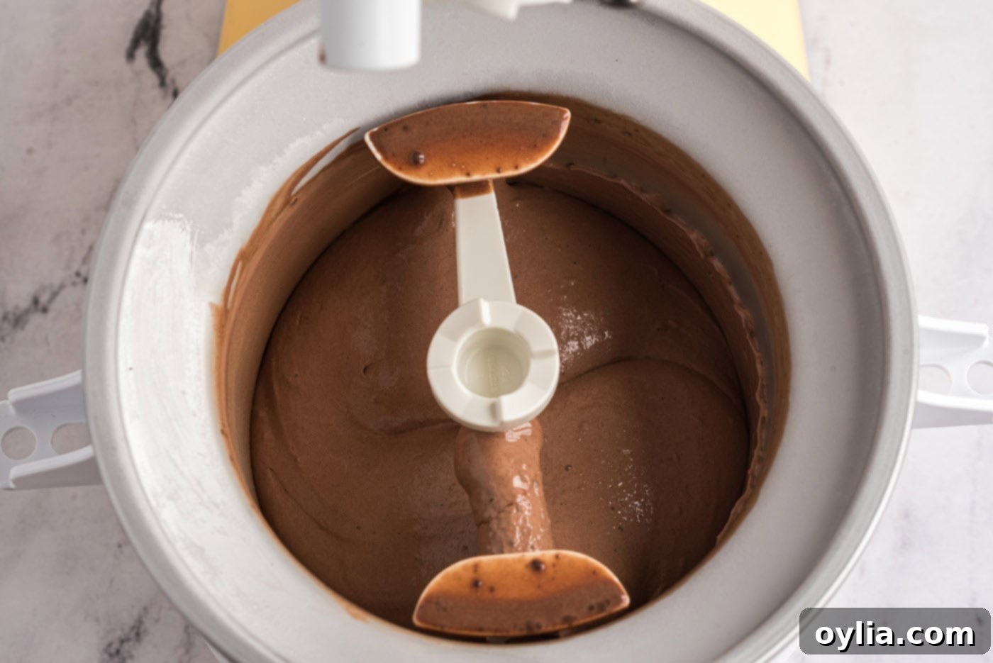 Churning chocolate ice cream in an ice cream maker